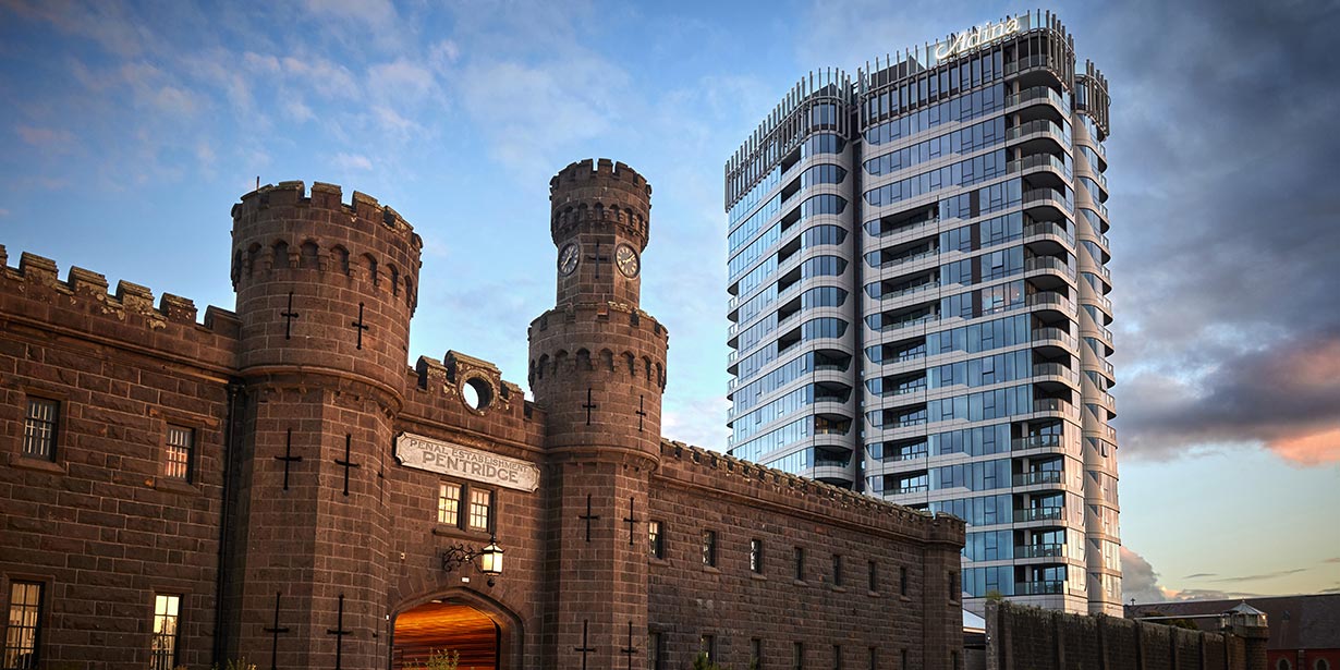 Initially built in 1858 as a 'model' prison, 'B Division' has been transformed into a 21st-century hotel, now operated as an Adina Hotel. The addition of an 18-storey tower, housing additional hotel rooms and residential floors, above the prison walls, marks a significant site transformation.